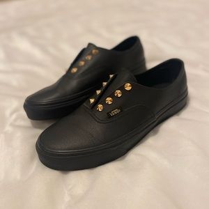BLACK LEATHER GOLD STUDDED SLIP-ON VANS